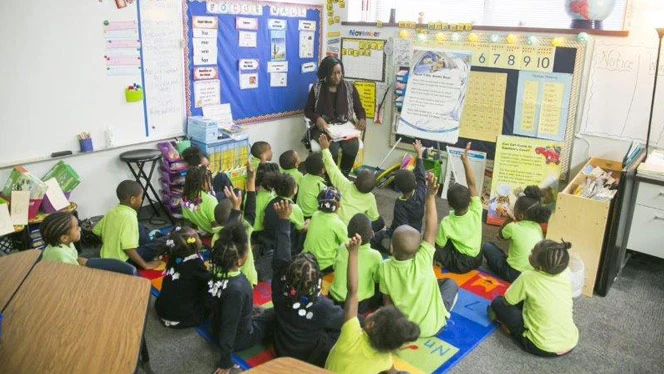 Teacher talking to her class. Teacher talking to her class.
