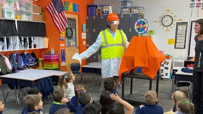 Safety Man talking to students about being safe.