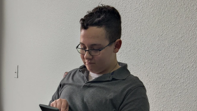Student calculating price.