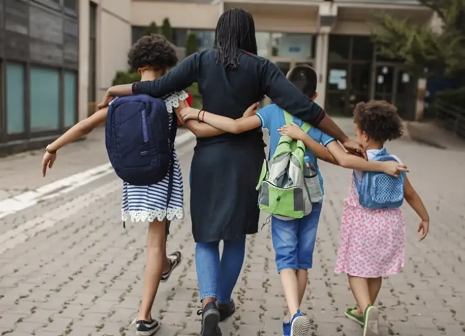 Mom and kids walking to school