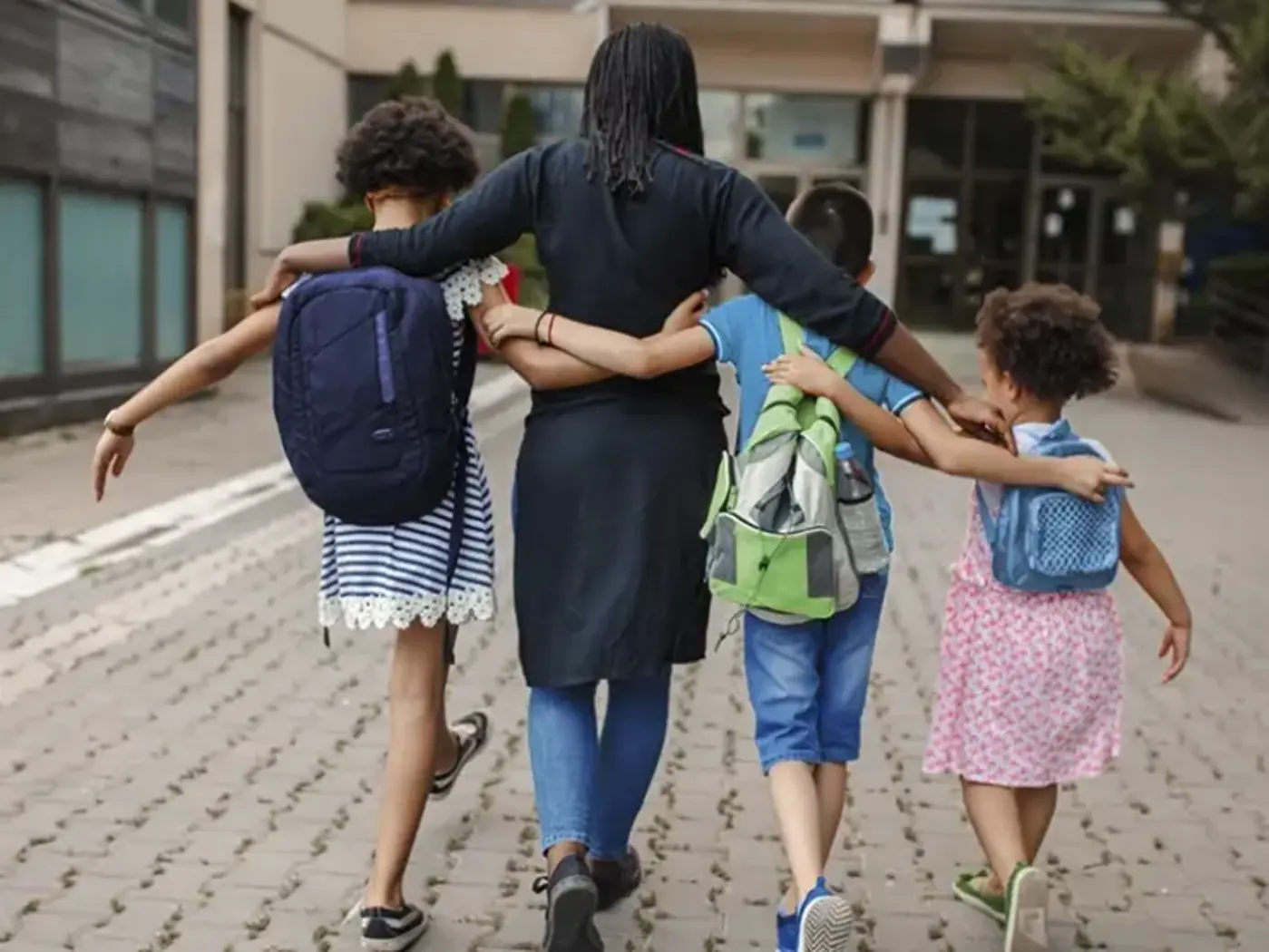 Mom and kids walking to school