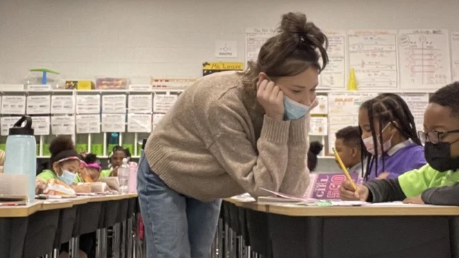 Jessica Lollie works with a student