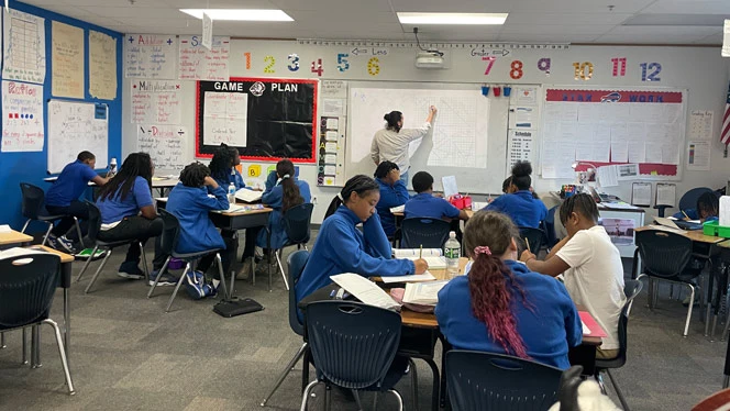 Treu teaching math at Buffalo United Charter School