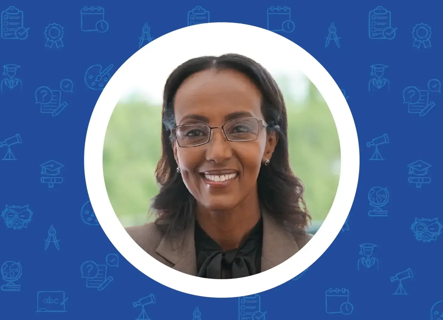 a woman wearing glasses and a brown jacket