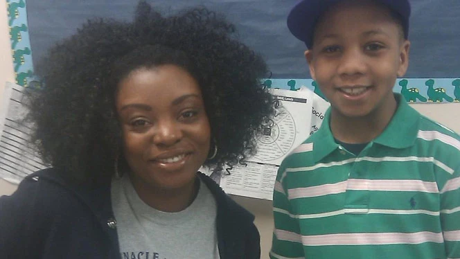Woman smiling with a student. Woman smiling with a student.