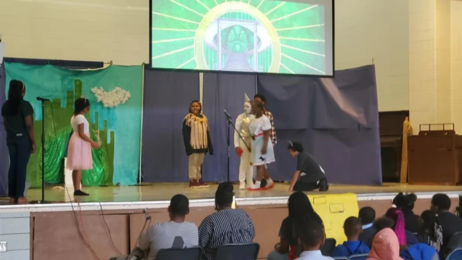 students acting on stage