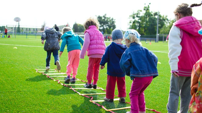 Students exercising outdoors. Students exercising outdoors.