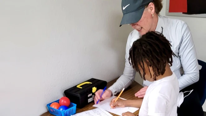 Paramount teacher working with a student