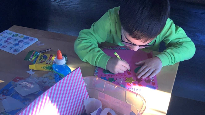 Student making Valentine's card