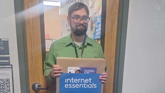 Teacher with laptop.