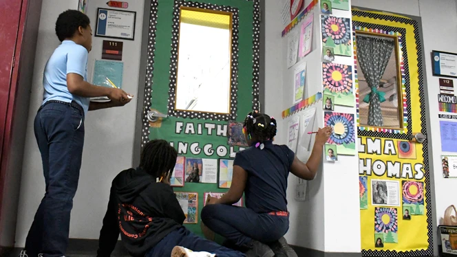 Detroit Merit students view door display