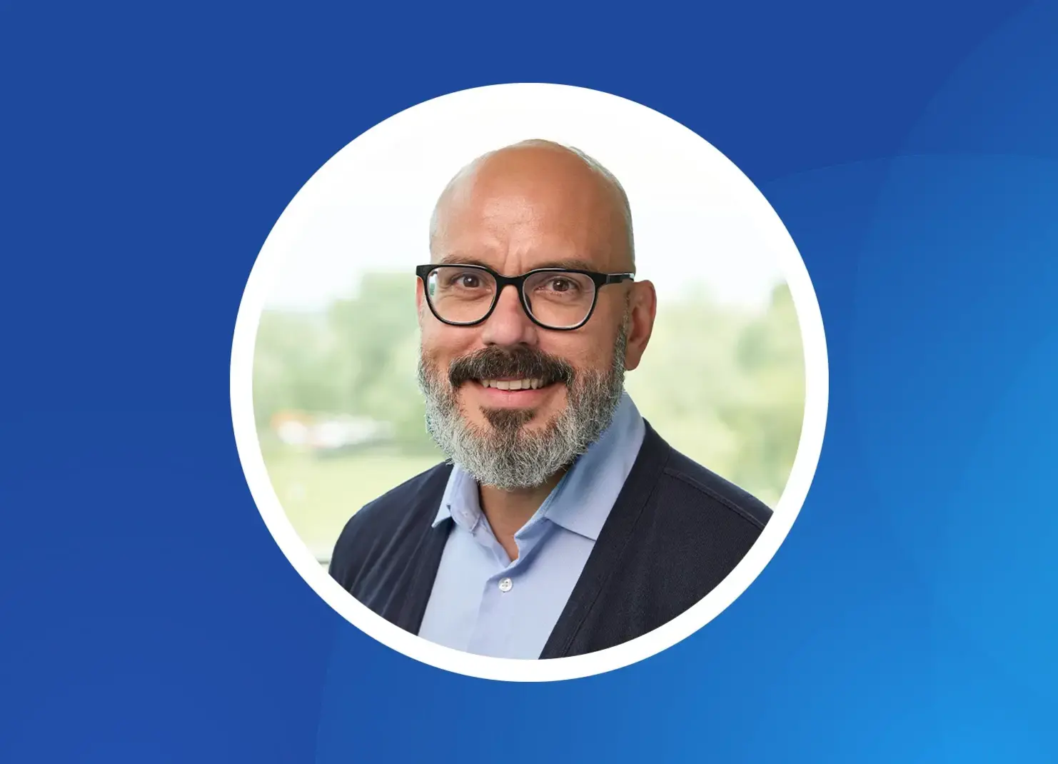 a man with a beard wearing glasses