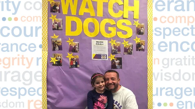 Father and daughter standing with each other.