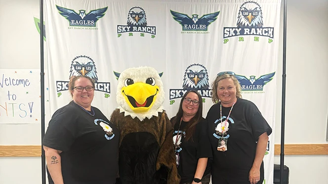 K-9 School in Watkins: Sky Ranch staff takes a photo with their mascot, Esme the Eagle.