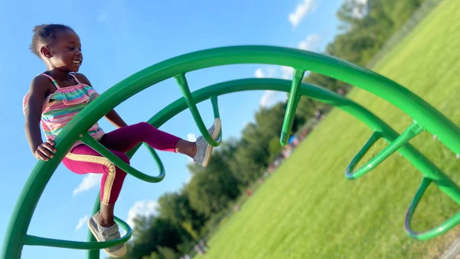 Child playing on the playground. Child playing on the playground.