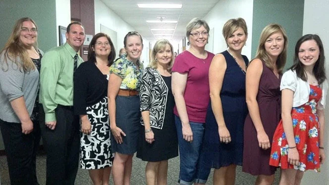 Staff members smiling. Staff members smiling.