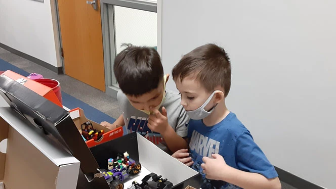 Students playing with Lego. Students playing with Lego.