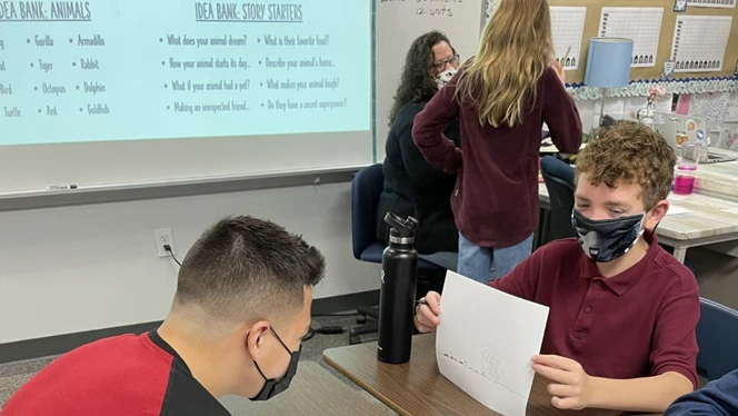 Students practicing writing tips Students practicing writing tips