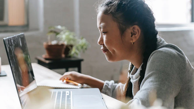 student working on computer