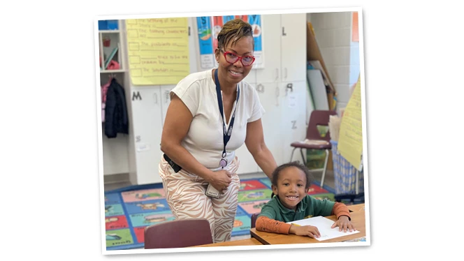 Ms. Berkeley-Cummins with student.
