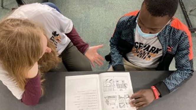Beth Graham and Valentino going over some homework. Beth Graham and Valentino going over some homework.