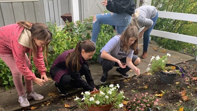 Chandler Woods students working on Kid's Food Basket farm