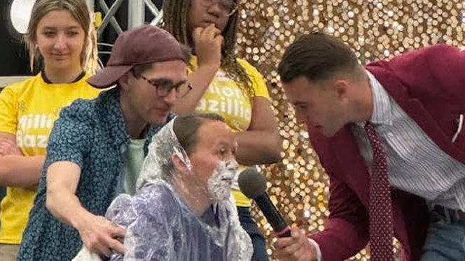 Landmark teacher getting pied in the face.