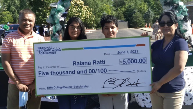 Raiana Ratti holding her scholarship. Raiana Ratti holding her scholarship.