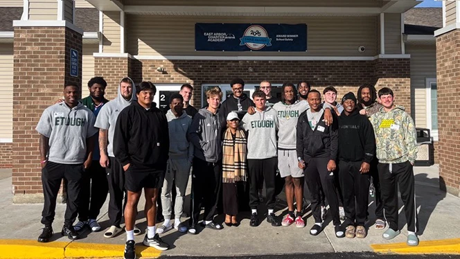 K-8 School in Ypsilanti: EMU football players visited East Arbor students.