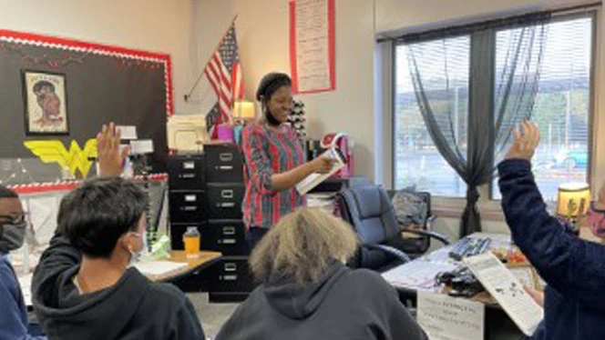 Teacher calling on a student. Teacher calling on a student.