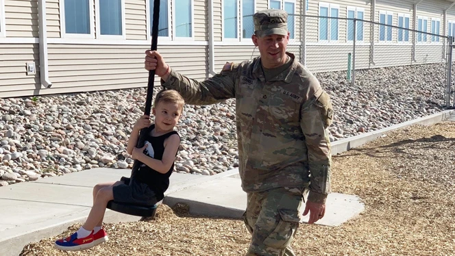 Parent and student on playground.