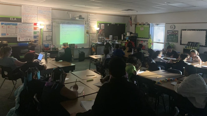 Students listening during an interim review session. Students listening during an interim review session.