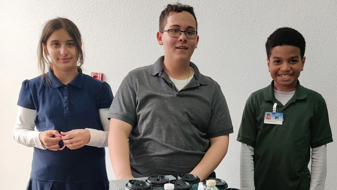 The three students who run the cafe.