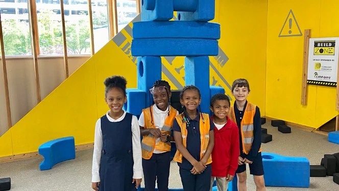 Group of students in front of exhibit