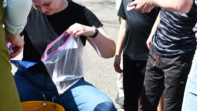 Y5-8 School in Walker: Walker Charter Academy students learn about salmon through the Michigan DNR.