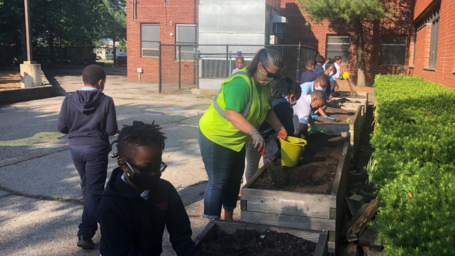 Detroit Merit students plant a school garden