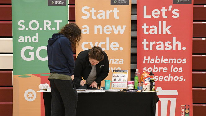 Wellspring Prep student talks with Kent County Dept. of Public Works rep.