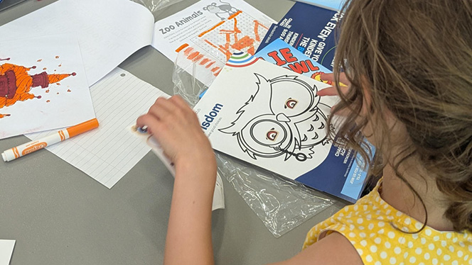 Charter School in Grand Rapids: NHA manager and author, reads her book to local NHA students.