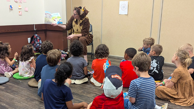 Charter School in Grand Rapids: NHA manager and author, reads her book to local NHA students.