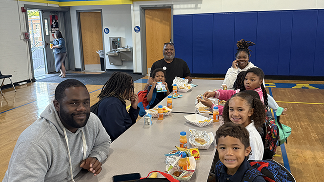 K-8 School in East Cleveland: Apex Academy father's and students participated in the school's Father Walk.
