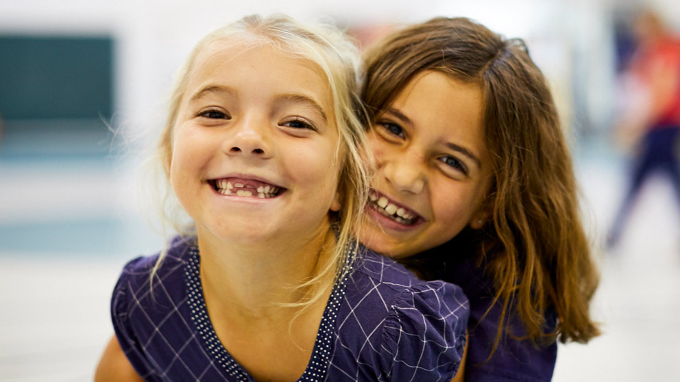 Two students smiling
