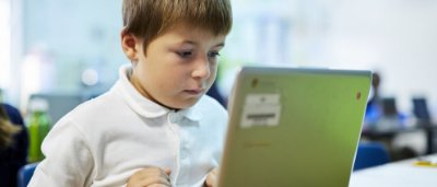 Student completing work in classroom