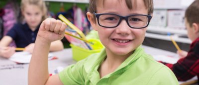 Student smiling in classroom