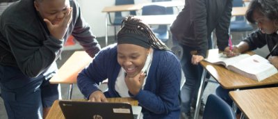 Students completing work in classroom