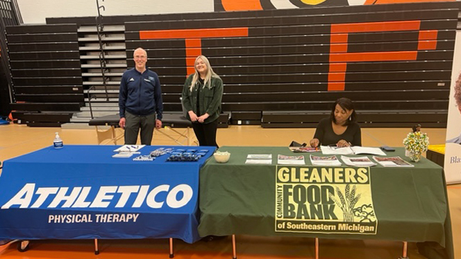 Athletico Physical Therapy and Gleaners Community Food Bank information tables