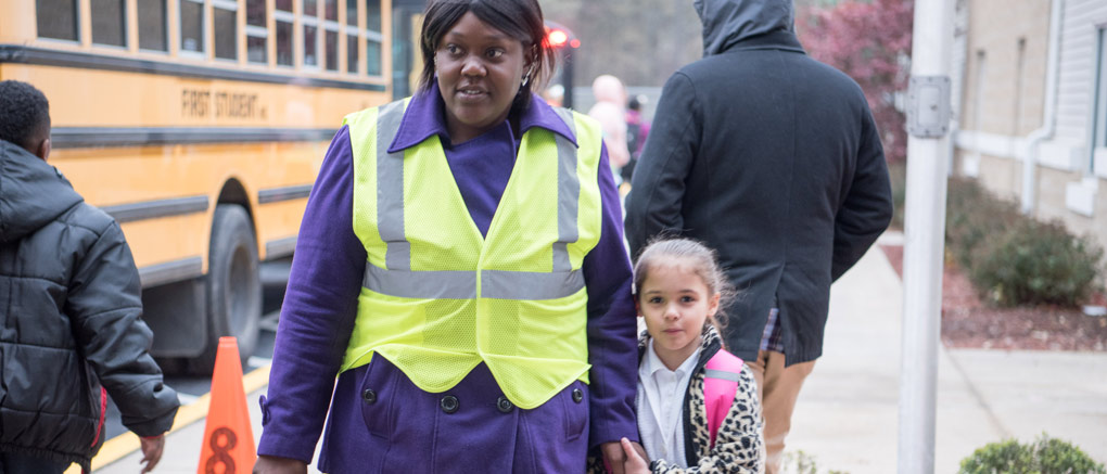 Teacher with arriving student