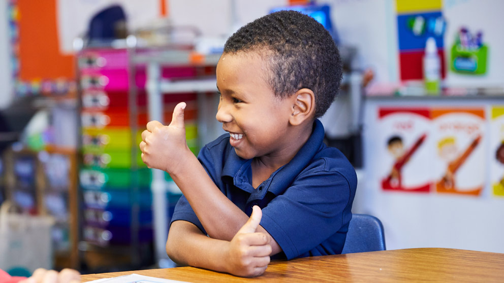 Student giving thumbs up