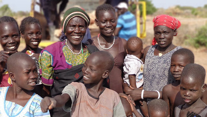 South Sudanese people smiling.