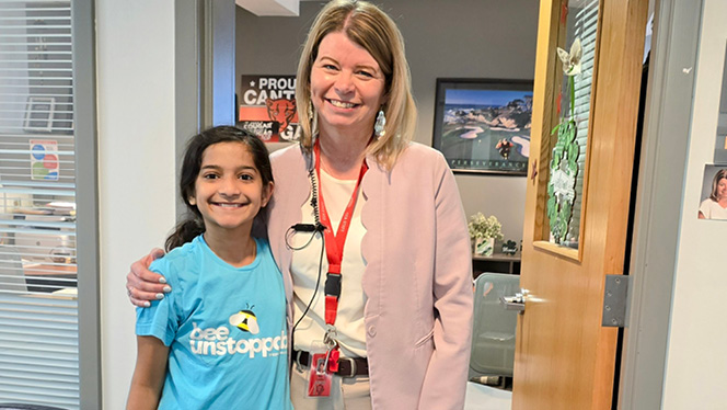 K-8 School in Canton: Canton Charter Academy Principal Conley with student Divya.