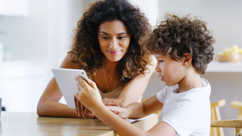 Student reading through assignment with mom